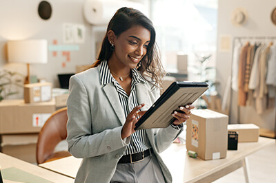 Business owner looking at her tablet